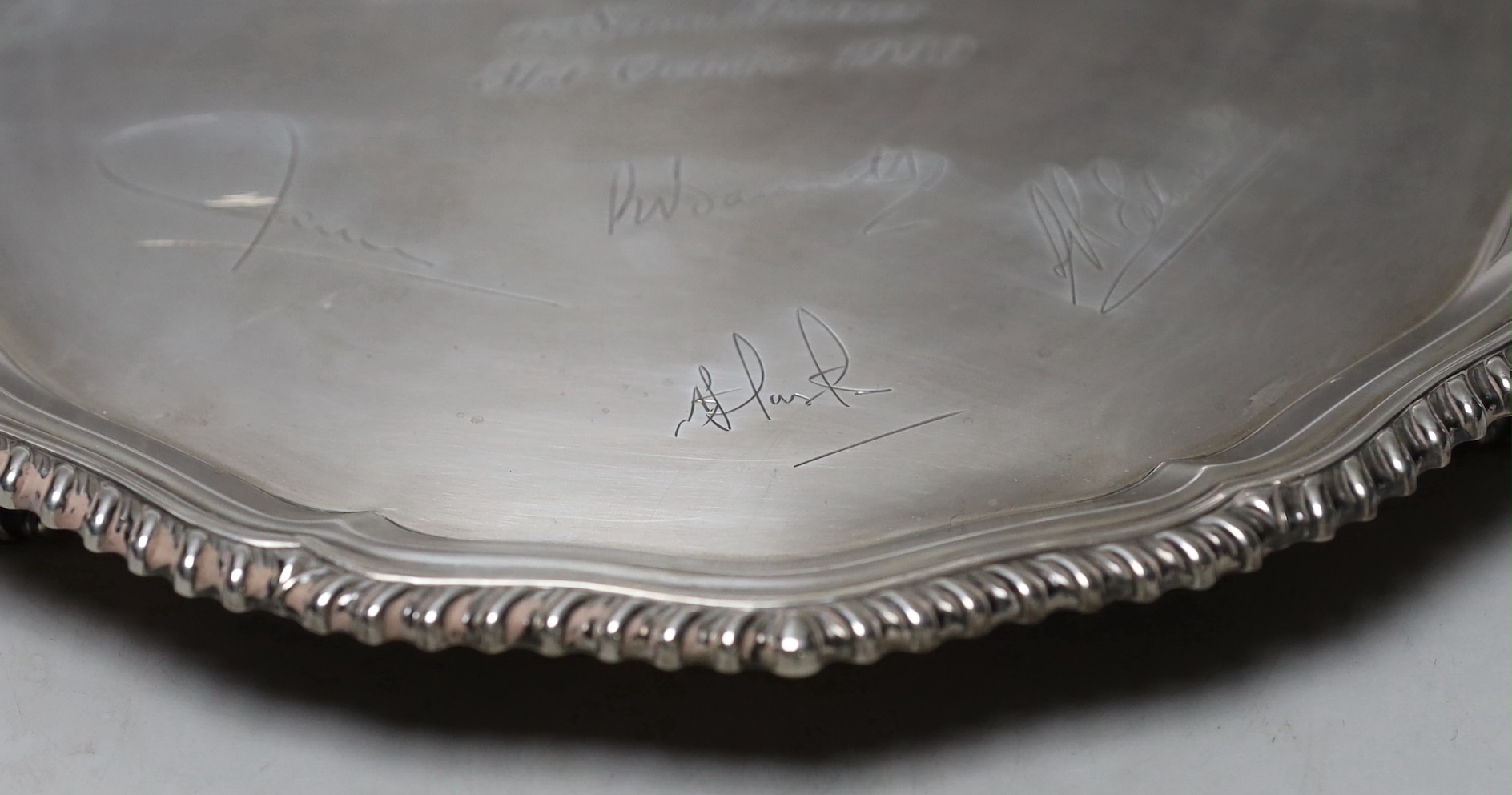 An Elizabeth II silver salver, with engraved signatures and inscription, C.J. Vander Ltd, London, 1990, 31cm, 31.6oz.